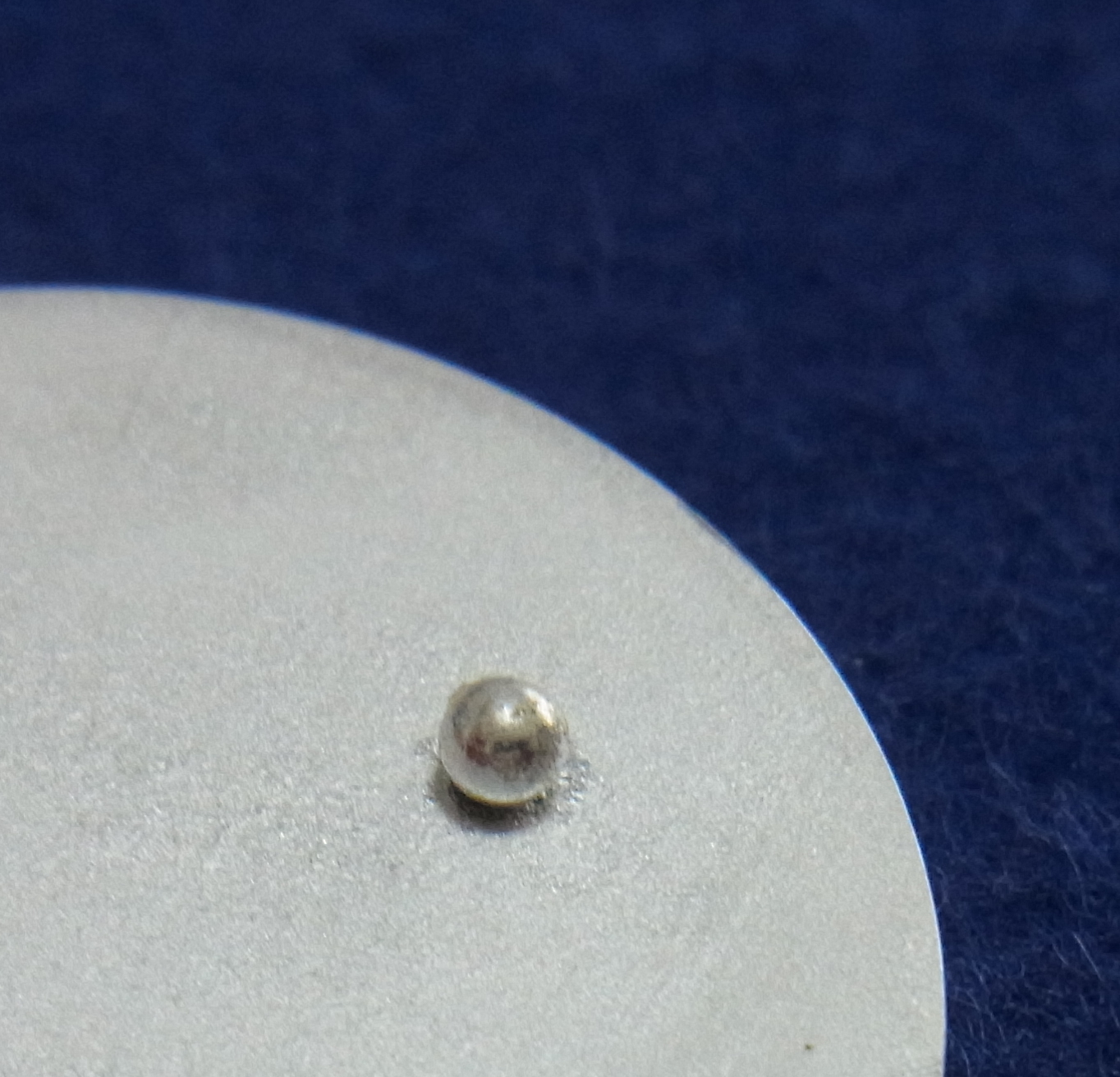 Silver granules joined to a silver plate (viewed from above)