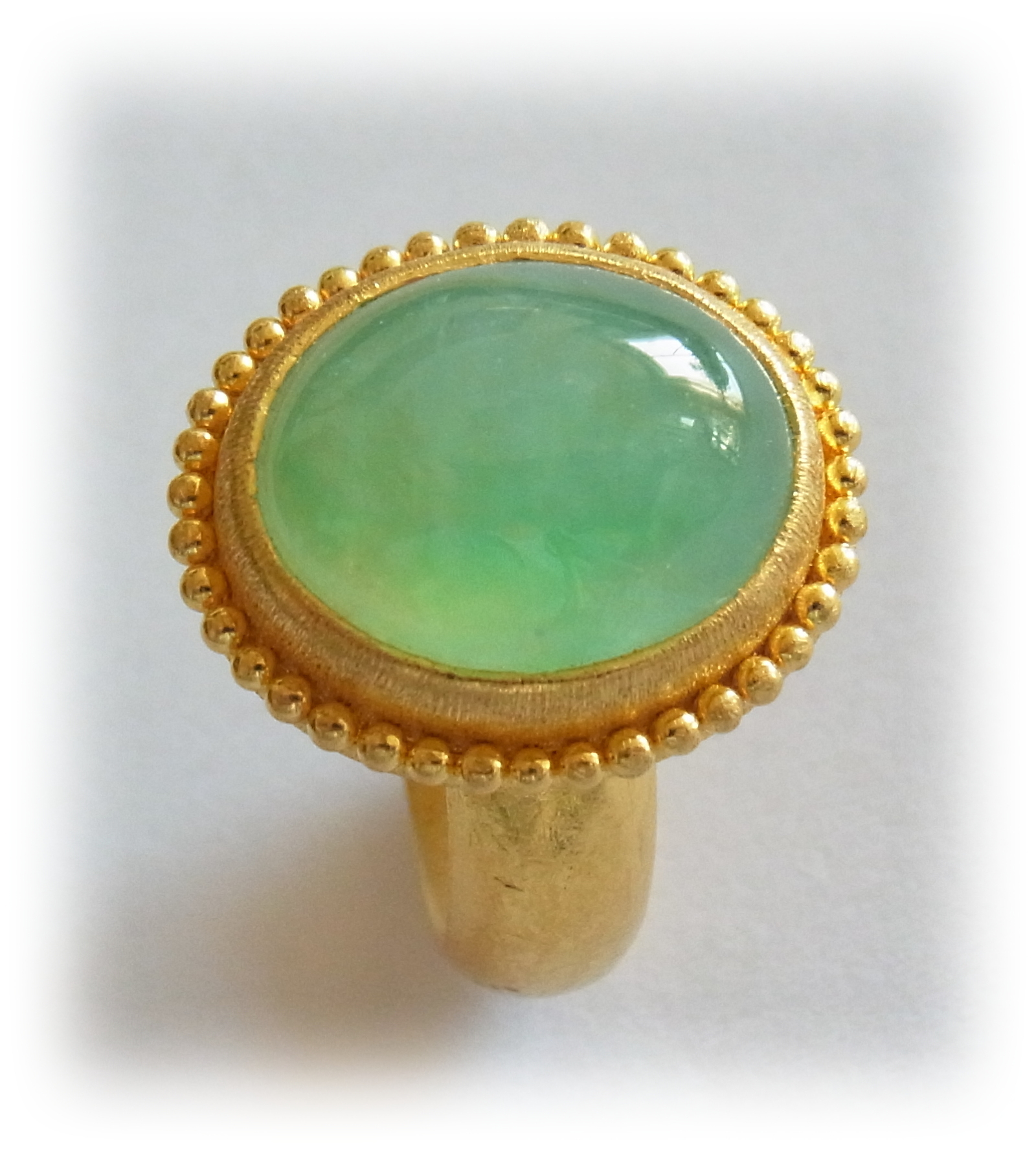 Oval-cabochon Jadeite ring with gold granulation
