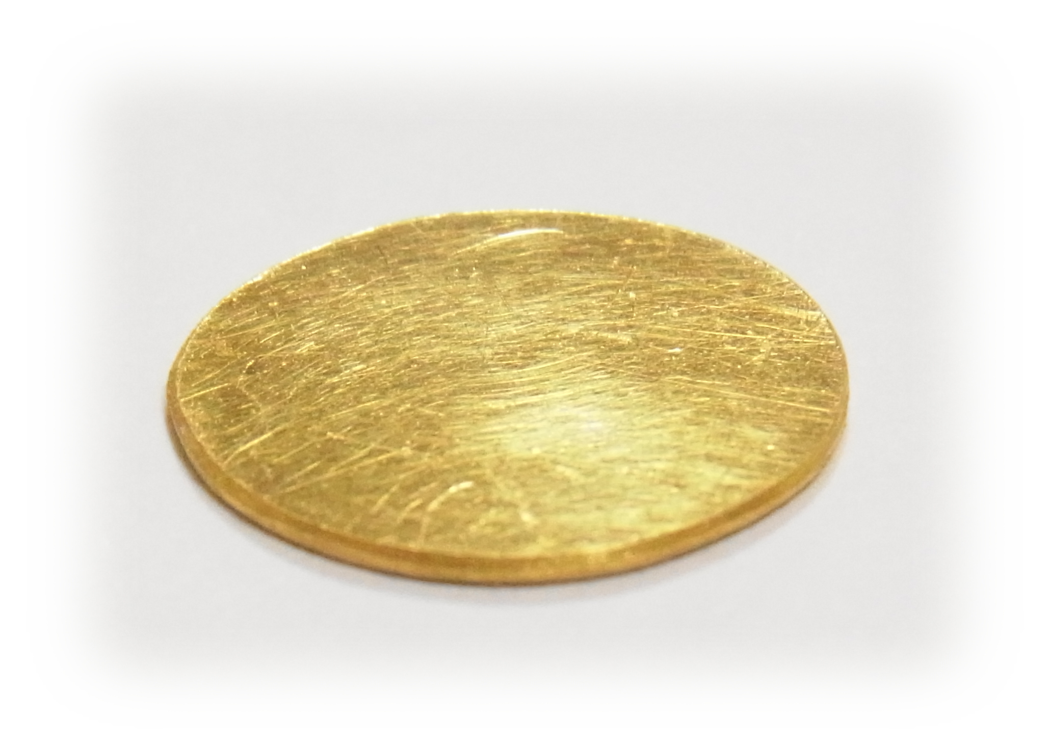 Step5: Cut out an oval gold plate on which Jadeite stone is placed.